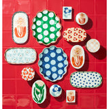 Jones & Co Paradis Scallop Green Tray displayed on a table with decorative items in a stylish home setting.