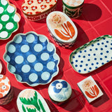 Jones & Co Paradis Ciao Box trivet with colorful, artistic design, perfect for protecting surfaces during meals.