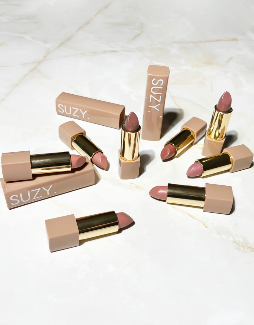 Suzy Lipsticks Honey Satin Luxe lipstick, creamy beige shade, with smooth satin finish, in elegant packaging.