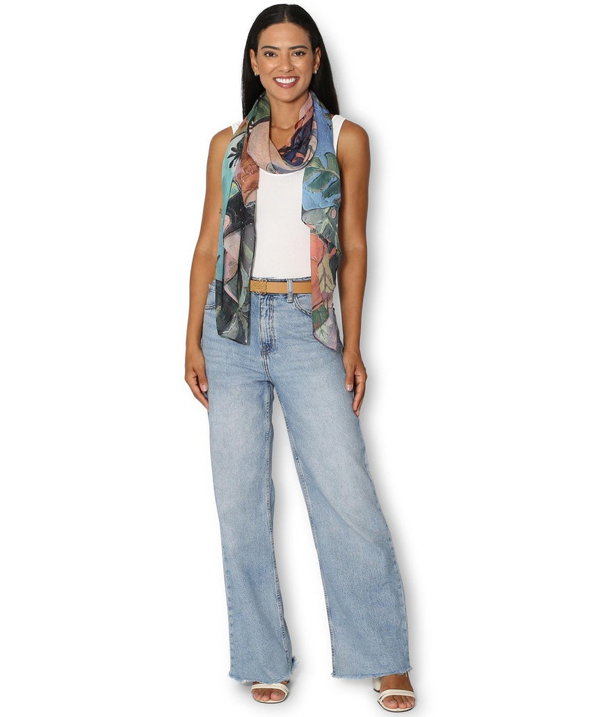 The Artists Label Day in Tahiti scarf worn by a model, featuring vibrant tropical print and lightweight fabric.