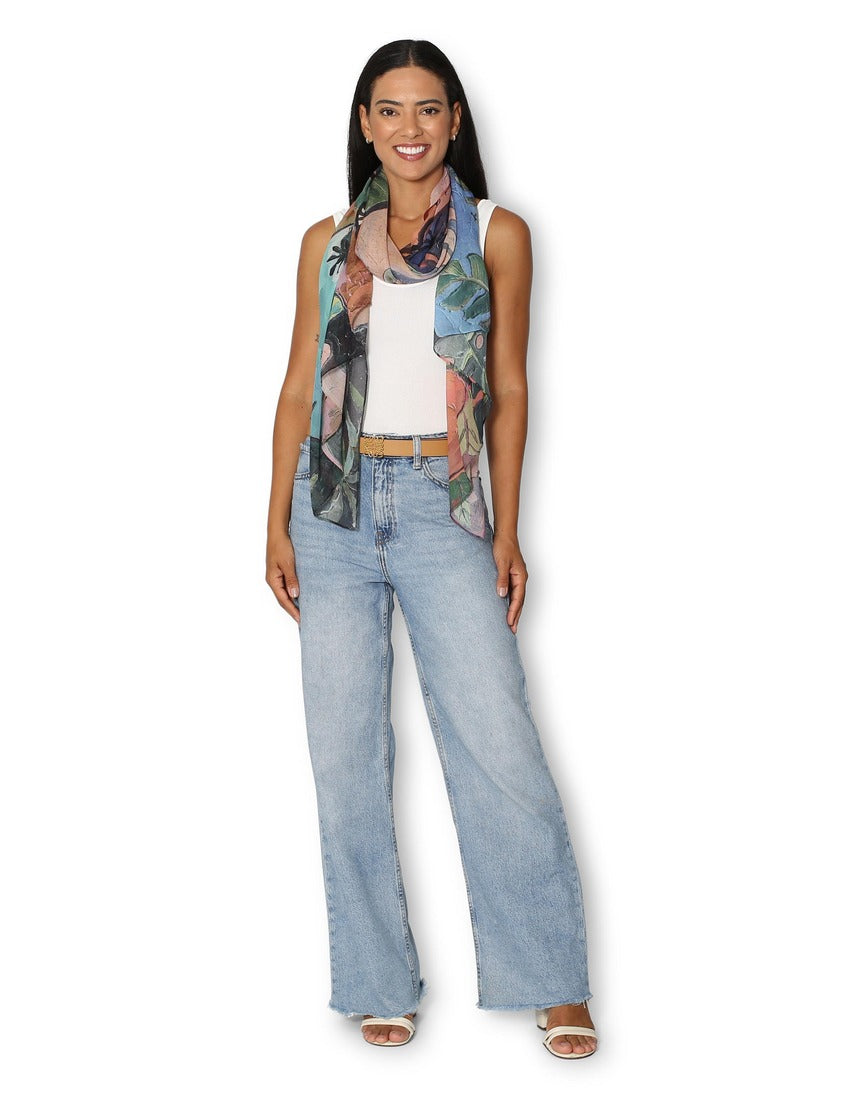 The Artists Label Day in Tahiti scarf worn by a model, featuring vibrant tropical print and lightweight fabric.