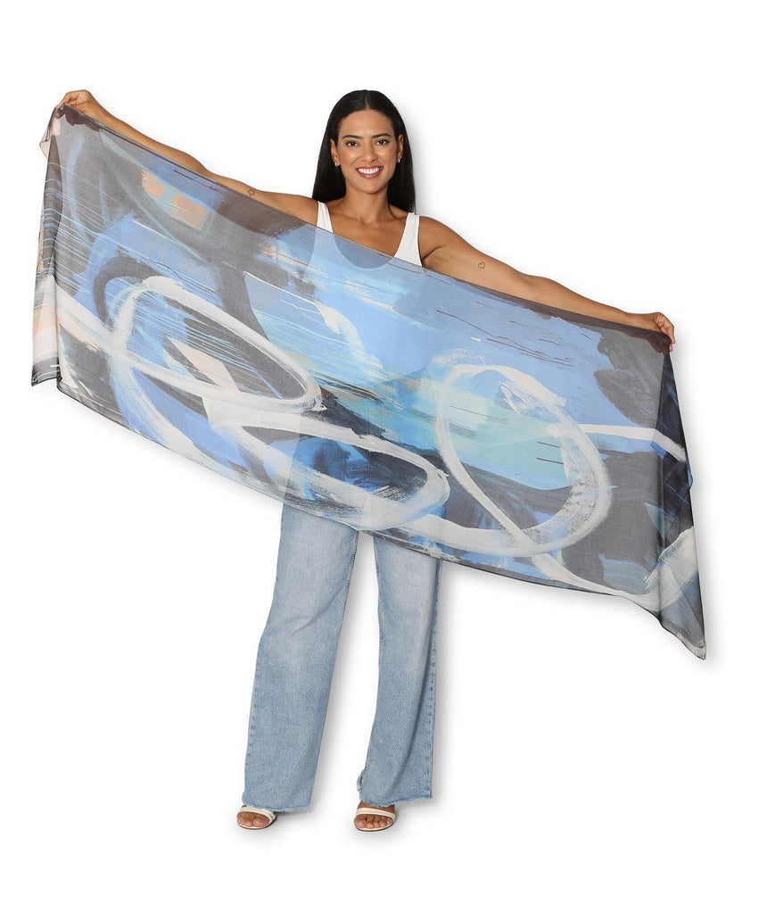 The Artists Label Blues and Roots Scarf featuring vibrant blue and earthy patterns, displayed flat on a neutral background.