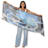 The Artists Label Blues and Roots Scarf featuring vibrant blue and earthy patterns, displayed flat on a neutral background.