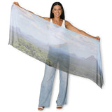 The Artists Label Glass House Mountains scarf featuring a vibrant mountain landscape pattern on soft fabric.
