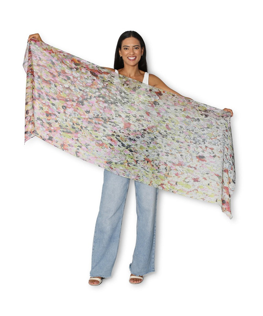 The Artists Label Julie’s Garden scarf featuring a vibrant floral pattern on soft fabric, displayed flat in natural light.