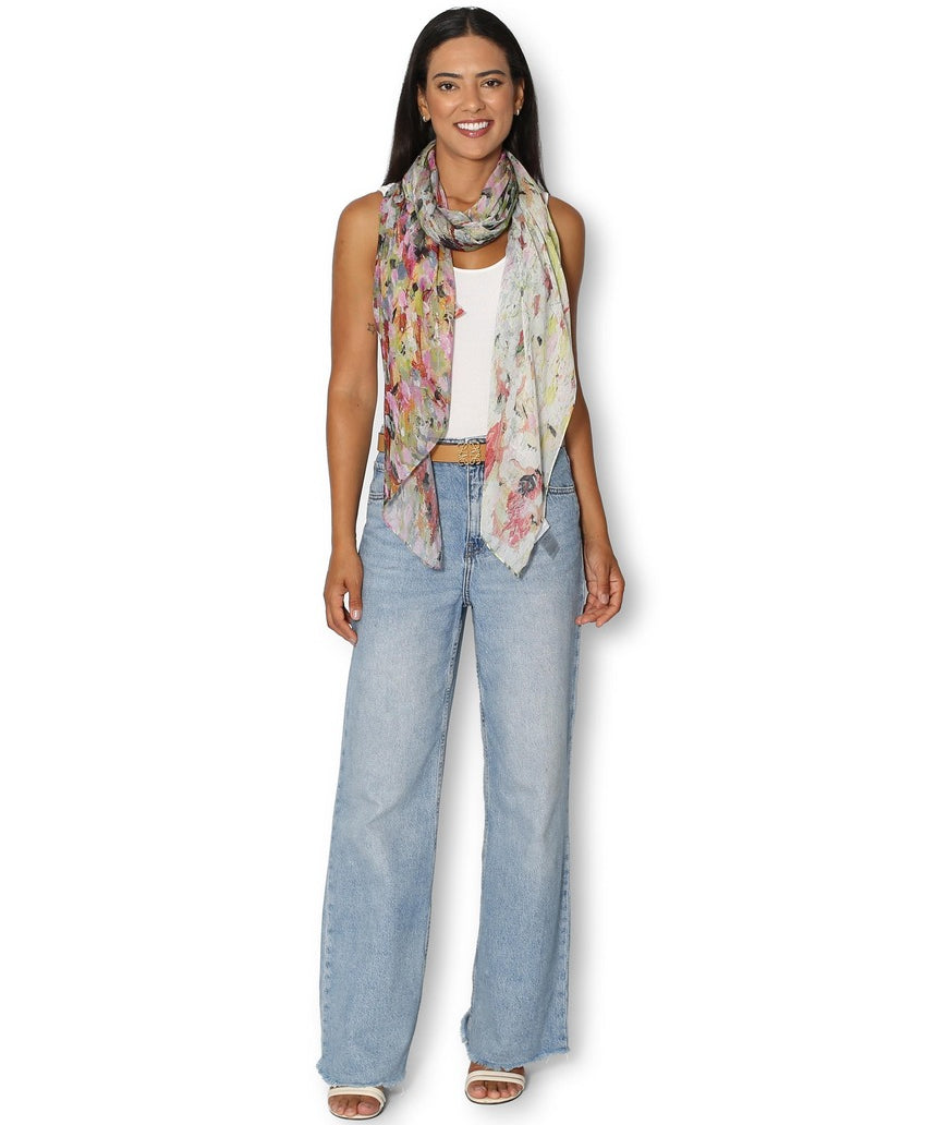 Model wearing The Artists Label Julie’s Garden scarf featuring floral patterns and vibrant colors.