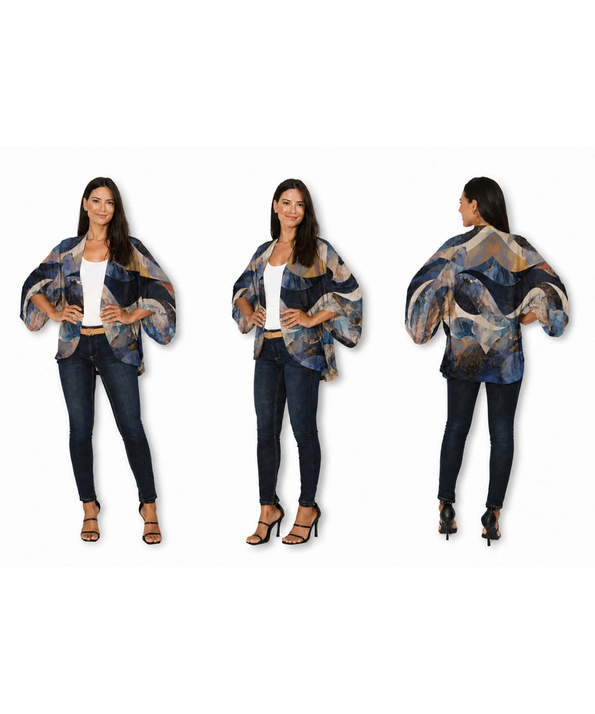 Silk kimono from The Artists Label with celestial wave pattern, flowing fabric, and elegant design for stylish wear.
