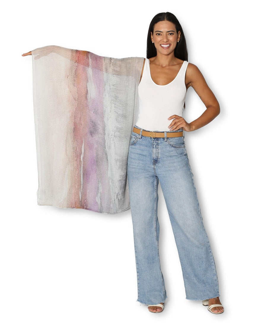 The Artists Label Transformation infinity scarf featuring a colorful, abstract pattern in soft fabric, laid flat for display.