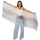 The Artists Label Transformation silk chiffon scarf featuring vibrant abstract patterns in bright colors and flowing fabric.