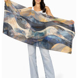 The Artists Label Celestial Waves viscose modal scarf featuring a flowing wave pattern in soft blue and white tones.