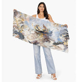 The Artists Label Echoes Of Creation viscose modal scarf with abstract blue and white patterns draped elegantly.