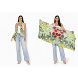 The Artists Label Jardin D’Orange viscose modal scarf featuring vibrant orange and floral patterns, lightweight and soft fabric.