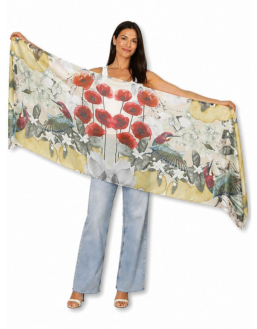 The Artists Label Jardin D’Orange viscose modal scarf with vibrant orange and floral patterns, lightweight and soft fabric.