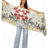 The Artists Label Jardin D’Orange viscose modal scarf with vibrant orange and floral patterns, lightweight and soft fabric.