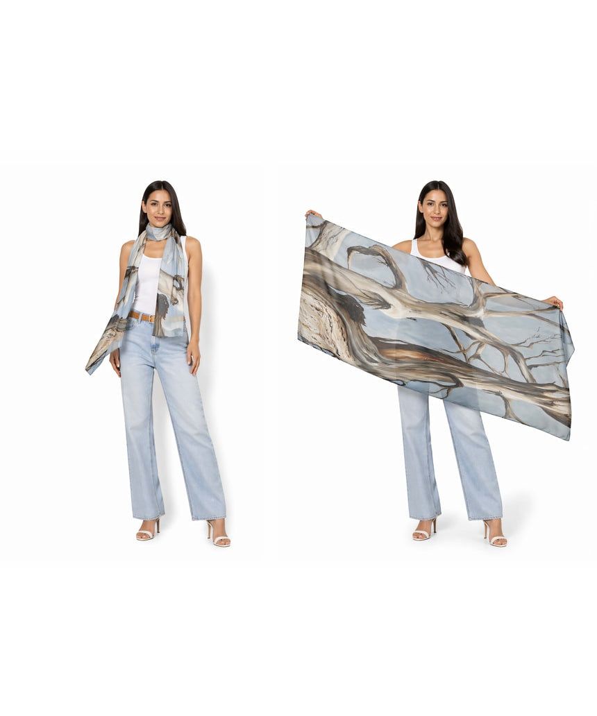 The Artists Label Reaching Light viscose modal scarf featuring soft fabric with a flowing, artistic design in light tones.