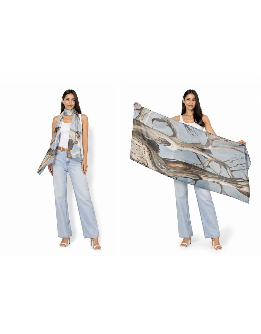 The Artists Label Reaching Light viscose modal scarf featuring soft fabric with a flowing, artistic design in light tones.