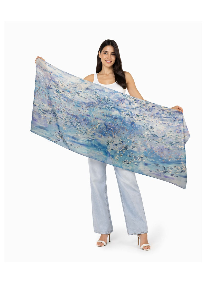 The Artists Label viscose modal scarf featuring a "Swept Beneath The Sea" design with flowing, ocean-inspired patterns and vibrant colors.