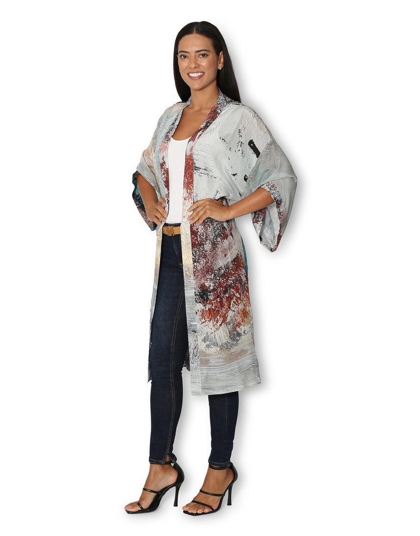 Side view of The Artists Label Winter Dance long silk kimono featuring flowing fabric and intricate design details.