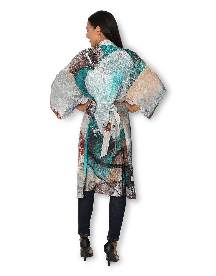 Back view of The Artists Label Winter Dance long silk kimono with intricate patterns and flowing fabric in a luxurious design.