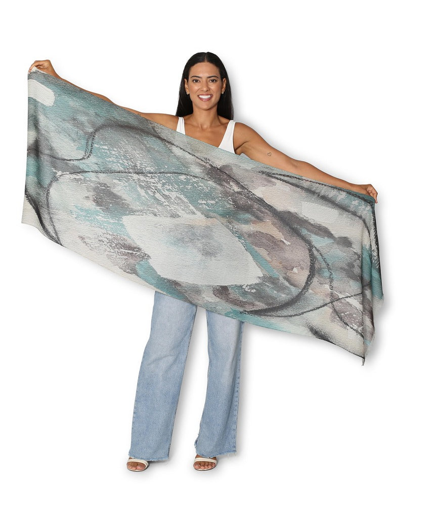 The Artists Label Winter Dance Wool Scarf displayed flat, showcasing soft, cozy wool fabric in a stylish, versatile design.