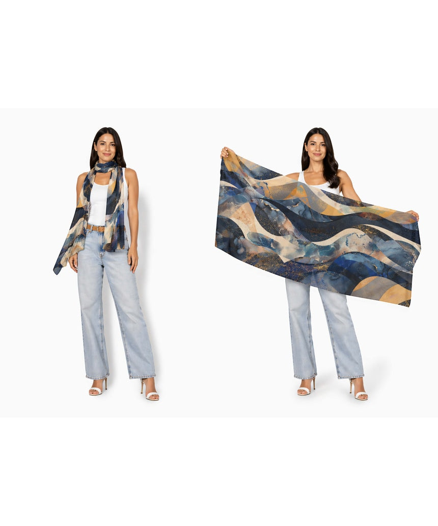 Wool scarf with celestial wave pattern from The Artists Label, featuring soft fabric and artistic design in shades of blue and gray.