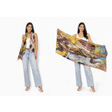 The Artists Label The Source wool scarf featuring soft, warm fabric with a stylish design in neutral tones.