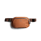 Bellroy Venture Hip Pack in bronze, compact and durable travel bag with adjustable strap and multiple compartments.