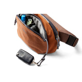 Bellroy Venture Hip Pack in bronze shown with adjustable strap and multiple compartments for organized carrying.