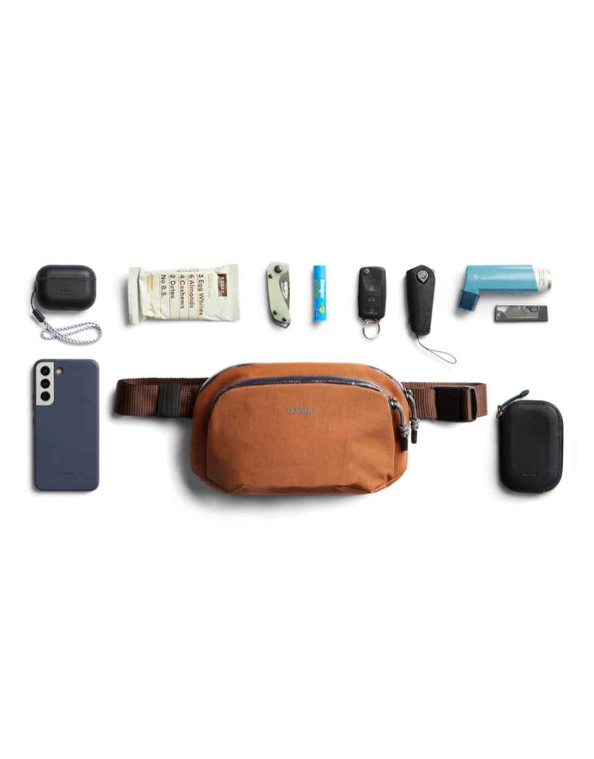 Bellroy Venture Hip Pack in bronze, compact travel bag with multiple compartments and adjustable strap, designed for convenience.