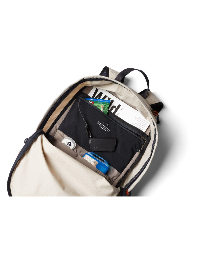 Bellroy Lite Daypack in Ash color showing its compact design with multiple compartments and adjustable straps.