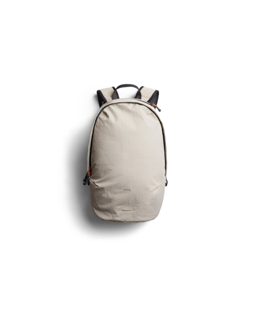 Bellroy Lite Daypack in Ash color, showing a sleek compact backpack with multiple compartments and adjustable shoulder straps.