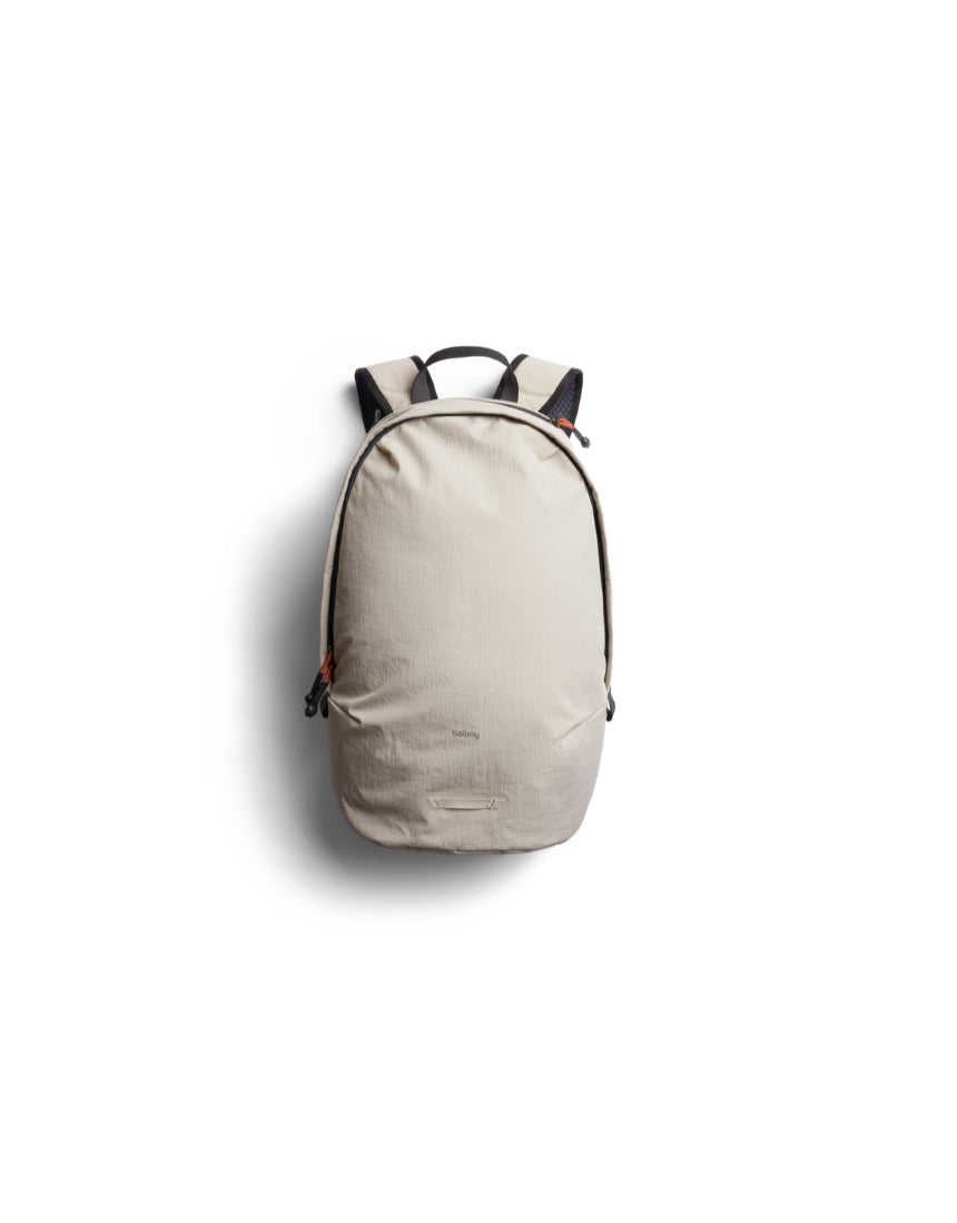 Bellroy Lite Daypack in Ash color, showing a sleek compact backpack with multiple compartments and adjustable shoulder straps.