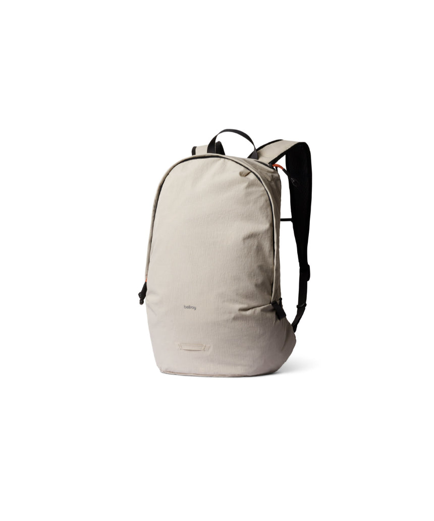 Bellroy Lite Daypack in ash color, compact and lightweight backpack with multiple compartments and padded shoulder straps.