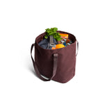 Bellroy Market Tote in burgundy, a stylish and spacious leather bag with handles, perfect for shopping and everyday use.