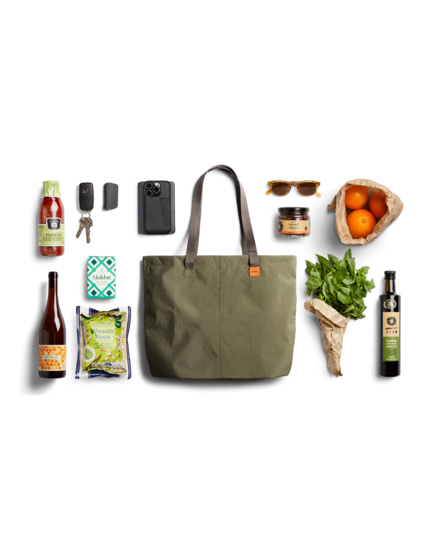 Bellroy Market Tote in Willow color, a spacious and stylish fabric shopping bag with leather handles and Bellroy branding.