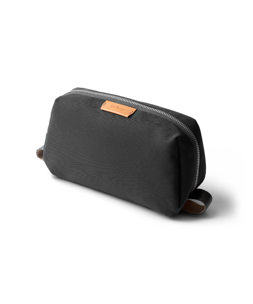 Bellroy Slate toiletry kit with multiple compartments, compact design, and durable material for travel organization.
