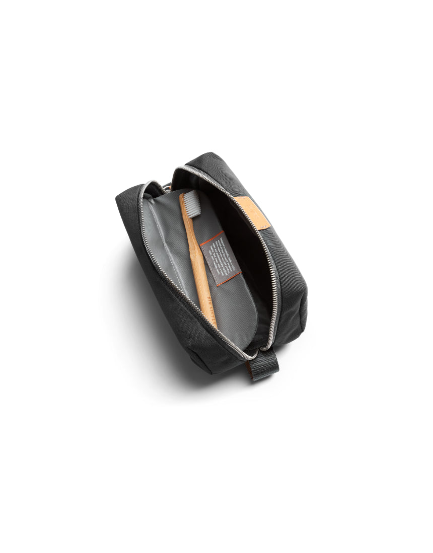 Bellroy Slate toiletry kit with multiple compartments showing durable fabric and zipper closure for travel organization.
