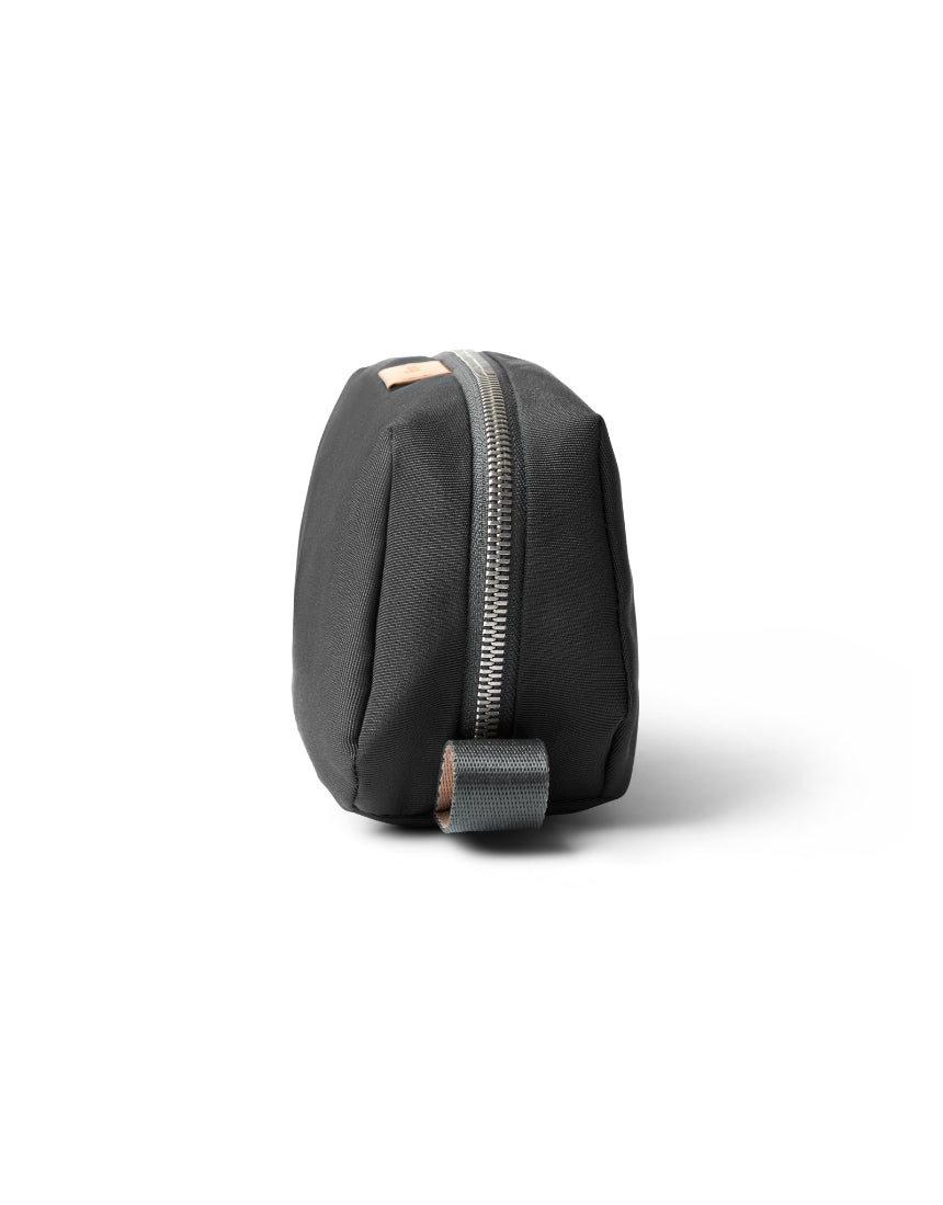 Bellroy Slate toiletry kit with zipper closure and multiple compartments, designed for organized travel storage.