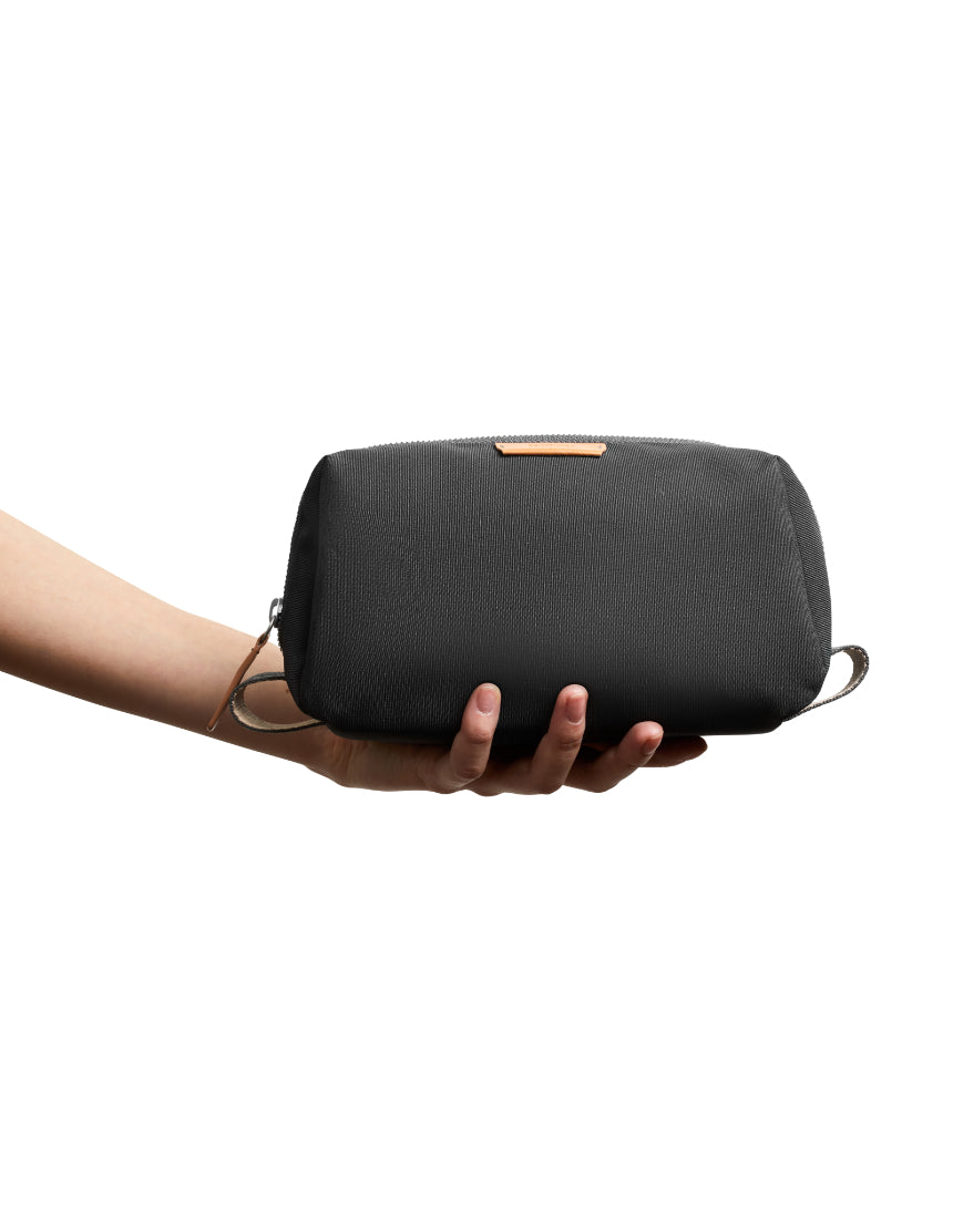 Bellroy Slate toiletry kit with zipper closure and multiple compartments for organizing grooming essentials.
