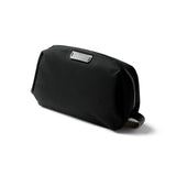 Bellroy black toiletry kit showing compact design with zipper closure and multiple compartments for travel essentials.