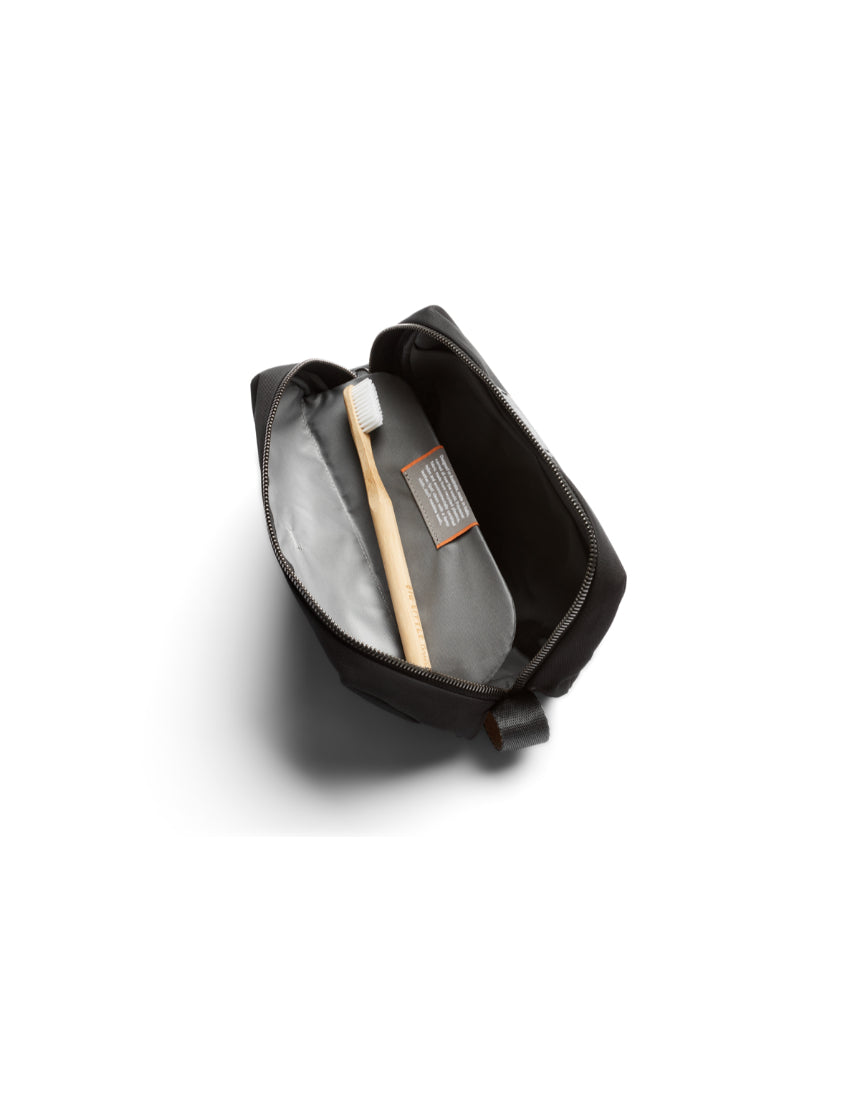 Bellroy black toiletry kit with zippered compartments and durable fabric for organizing travel essentials.