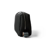 Bellroy black toiletry kit with zipper closure and multiple compartments for organizing personal grooming essentials.