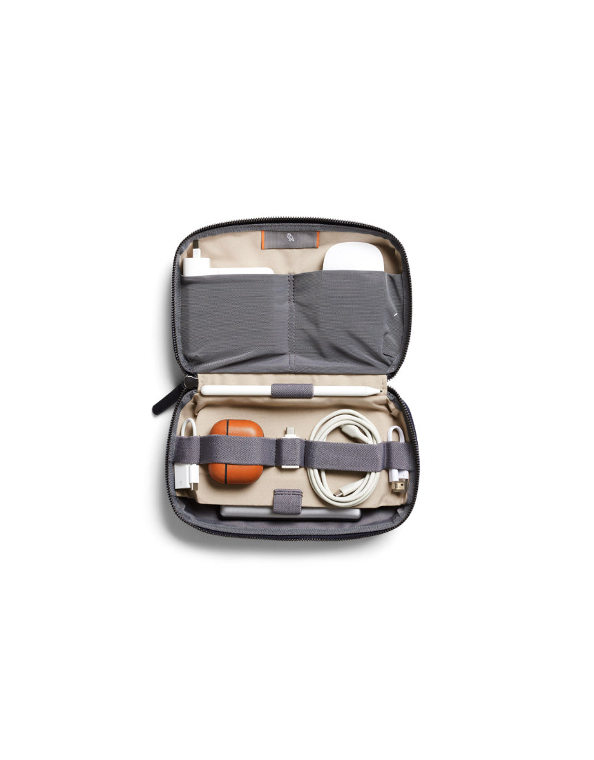 Bellroy Tech Kit in navy color with multiple compartments for organizing cables, chargers, and accessories.