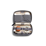 Bellroy Tech Kit in navy color with multiple compartments for organizing cables, chargers, and accessories.