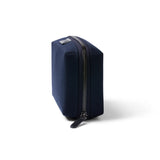 Bellroy Tech Kit in navy with multiple compartments for organizing cables, chargers, and electronic accessories.