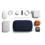 Bellroy Tech Kit in navy fabric with multiple compartments for organizing tech accessories and cables.
