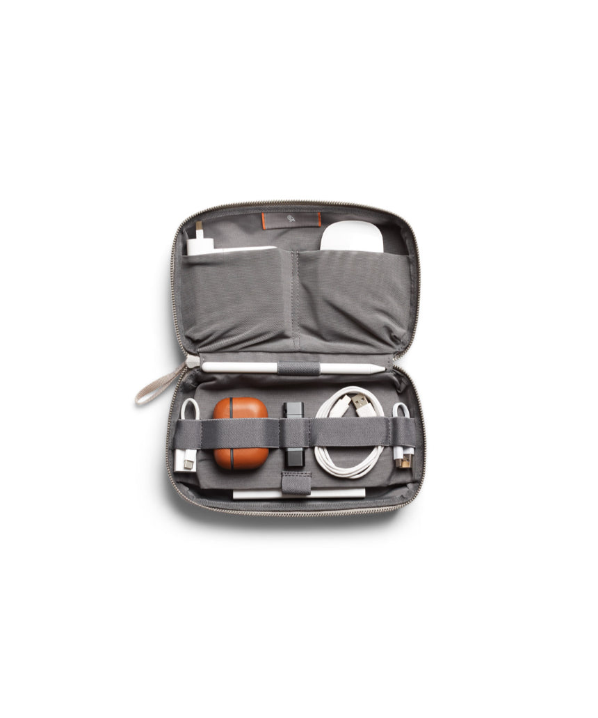 Bellroy Tech Kit Saltbush with multiple compartments for organizing cables, chargers, and accessories in a compact design.