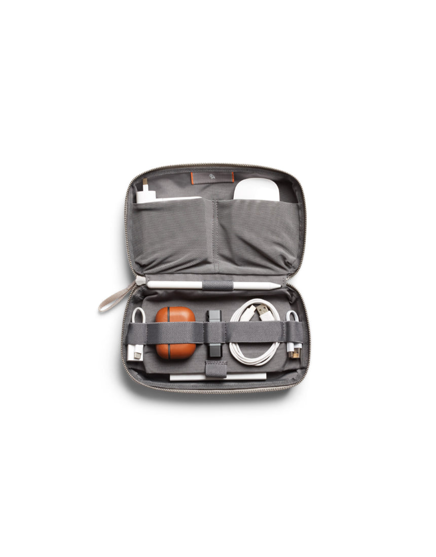 Bellroy Tech Kit Saltbush with multiple compartments for organizing cables, chargers, and accessories in a compact design.