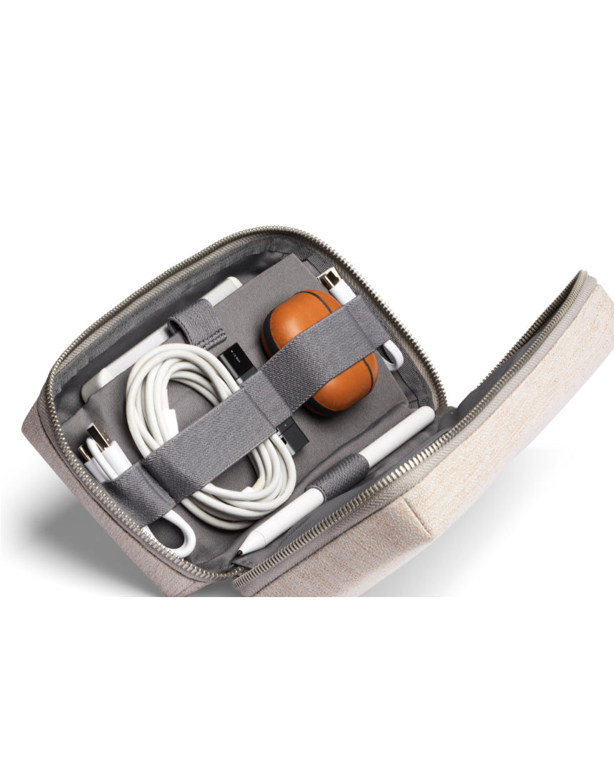 Bellroy Tech Kit Saltbush featuring organized compartments for cables, chargers, and tech accessories in a sleek design.
