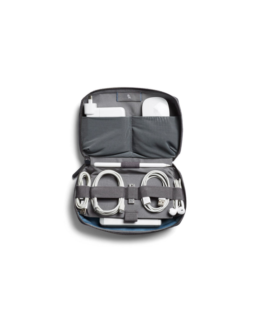 Bellroy Tech Kit in black, compact organizer with multiple compartments for cables, chargers, and electronic accessories.